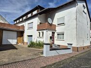 Zwei- bis Dreifamilienhaus mit Werkstatthalle und großer Terrasse zu verkaufen - Weisel