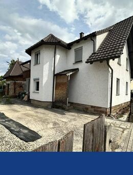 Wohnen & entwickeln: Einfamilienhaus mit Rohbau - Rheinau