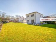 IMMOBERLIN.DE - Sehr attraktives Haus mit Sonnenterrasse, großem Garten & Garage in familiärer Lage - Wustermark