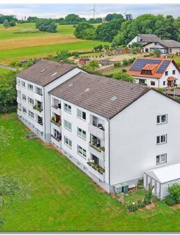 2 Mehrfamilienhäuser mit 12 Wohnungen, komplett vermietet in schöner Feldrandlage von Helsa - Helsa