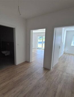 Neubau Erdgeschosswohnung mit Terrasse und Garten - Hessisch Lichtenau