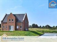 Ferienhaus mit Wassergrundstück im Fischerdorf - Neubau in traumhafter Lage - Krummhörn