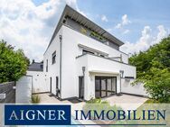 AIGNER - Hochwertige Wohnung auf zwei Ebenen mit Garten und Pool in Südwest-Ausrichtung - München