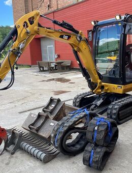 Caterpillar302_4 minibagger top mit Mit Anhänger + 3 Löffel + Zange + Rechen - Schwarzenbek