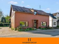 Einfamilienhaus mit ausbaufähigen Nebengebäuden - Wohnen, Arbeiten & Investieren in zentraler Lage - Loxstedt