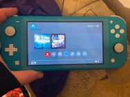 Switch lite blau mit Spiel und Hülle - Aschersleben Zentrum