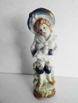 Porzellanfigur junges Mädchen mit Ente im Arm, Vogel - Königsbach-Stein