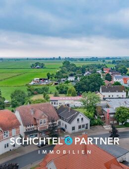 Butjadingen - Stollhamm | Spannendes Wohn- und Geschäftshaus in Bestlage - Butjadingen