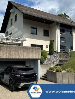 VR IMMO: Beeindruckendes Einfamilienhaus mit Einliegerwohnung, das keine Wünsche offen lässt! - Netphen