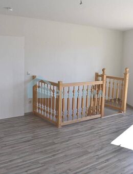 4-Zimmer-Wohnung mit Balkon, Einbauküche, wohnlichen Räumen im Souterrain & Stellplatzoption - Parchim