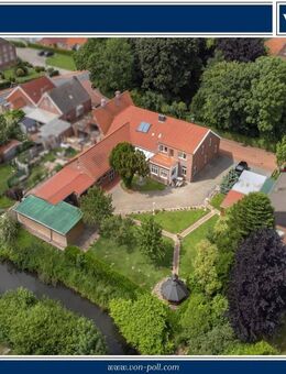 Großzügige Wohn- und Gewerbeimmobilie mit Gartenidylle am Wasser - Jemgum