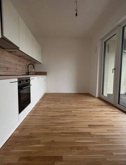 Attraktiver Erstbezug: 3-Raum-Wohnung mit separater Küche inkl. EBK, Balkon und Parkettboden - Leipzig