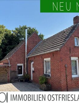 Sanierungsbedürftiges Einfamilienhaus mit Carport, kleinem Garten in zentraler Lage. - Krummhörn