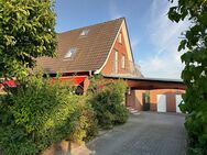 Doppelhaushälfte mit Garage, Carport und großem Garten im Zentrum - Uelsen