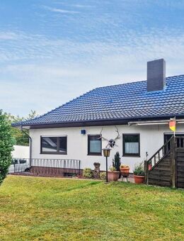 Bungalow in Liebenau mit schönem Grundstück, Garage und Vollkeller - Liebenau (Niedersachsen)