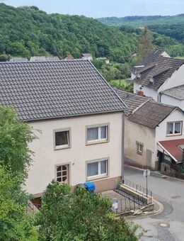 Familienhaus mit großem Inneren und kleinem Garten in ruhiger Lage. - Bettingen