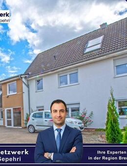 Moderne 3-Zimmer-Wohnung mit Einbauküche, Garten und Balkon in Syke-Barrien - Syke