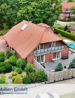 Attraktives Wohnhaus mit Pool, Garage und Gewerbeeinheit - Moormerland
