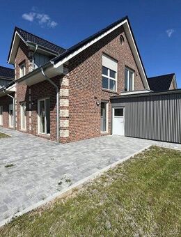 Vermietung: Erstbezug, moderne Erdgeschosswohnung mit Terrasse und Carport in Westoverledingen - Westoverledingen