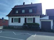 Zwei Häuser mit zwei Garagen auf einem Grundstück in Birkenau-Niederliebersbach - Birkenau