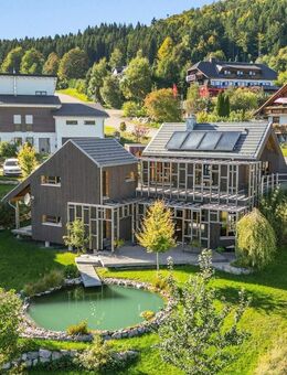 IMMORath.de - Idyllisches Holzhaus: Natur und Design vereint - Dachsberg (Schwarzwald)
