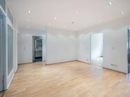 AIGNER - Helle Hochparterre-Wohnung mit Südausrichtung und verglaster Loggia - München