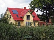 Mehrfamilienhaus mit Carports - Taura