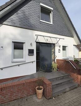 Volksbank Immobilien: Geräumiges Einfamilienhaus mit Terrasse, Garten & Bauplatz in Sittensen - Sittensen