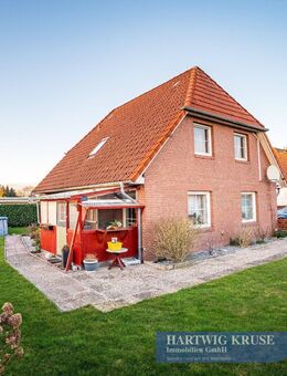 Wohnen oder Vermieten: Einfamilienhaus mit Wintergarten und Garage - Drochtersen