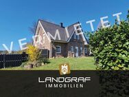 Modernes Einfamilienhaus in Hanglage mit Blick über Felder & Wiesen. - Dünsen