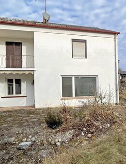 Renovierungsbedürftiges Dreifamilienhaus auf sonnigem Südgrundstück in ruhiger Lage - München