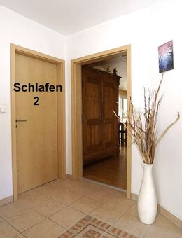 Platz für Ideen und Familie: Zweifamilienhaus mit Garten und Wohnkomfort - Bann