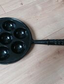 Pförtchenpfanne aus Gusseisen in 16341