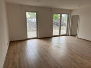 Neubau 2 Zimmer EG Wohnung mit Terrasse ,Garten , Keller, & Tiefgarage - Schmiechen