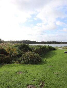 Wohnen am Wasser als Investment - Vermieteter Bungalow mit traumhaftem Russee-Blick - Kiel