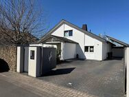 Designwohnen: Modernes Familienhaus mit offenem Raumkonzept und stilvollem Garten - Löhne