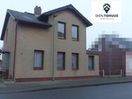 Dien Tohuus Immobilien bietet an: Einfamilienhaus mit Einliegerwohnung und Wohnung - Neumünster
