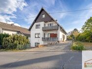 Voll vermietetes Anlageobjekt mit 3 großen Wohnungen und 4 Garagen - Horhausen (Westerwald)