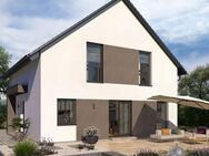 Kompaktes Ein­fa­mi­li­en­haus mit Rück­zugs­mög­lich­kei­ten in Aurau - Büchenbach