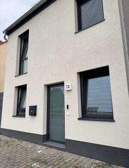 Familienfreundliche Doppelhaushälfte mit Terrasse und Gartenblick in Leuna - Leuna