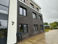 Moderne Erdgeschosswohnung in Wittmund: Neubau mit Sonniger Terrasse und Eigenem Grünbereich - Wittmund