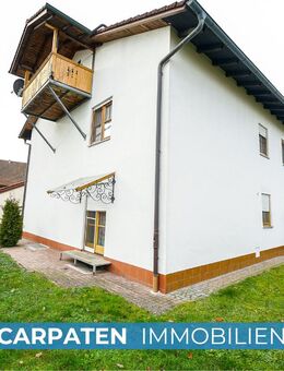Attraktives Mehrfamilienhaus kaufen: 3 Wohnungen, Garten & Garagen in 84518 Garching a.d. Alz - Garching (Alz)