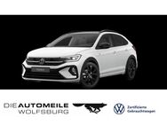 VW Taigo, 1.5 TSI OPF R-Line "Black Style", Jahr 2024 - Wolfsburg