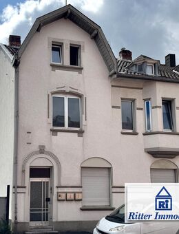 Ritter Immobilien e.K.: Gepflegtes MFH mit Innenhof & Doppelgarage in zentraler Lage von Kohlscheid! - Herzogenrath