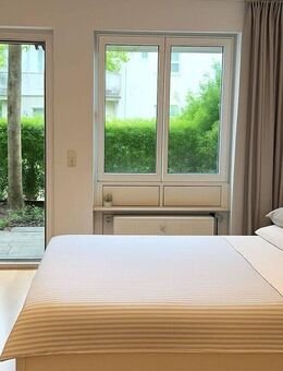 1 Grund mehr. - Ruhige, helle 1-Zimmer-Gartenwohnung mit Terrasse & Tiefgarage im grünen Harlaching - München