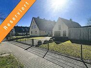 Dörverden - Hülsen: Gepflegte Doppelhaushälfte mit Keller, Nebengebäude, Garage und hübschem Garten - Dörverden