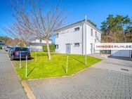 IMMOBERLIN.DE - Sehr attraktives Haus mit Sonnenterrasse, großem Garten & Garage in familiärer Lage - Wustermark