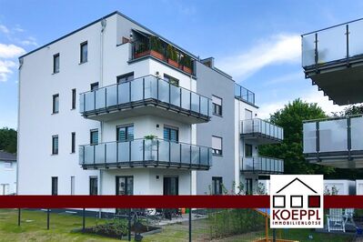 Kapitalanlage! Vermietete Erdgeschosswohnung mit Terrasse, Garten + Garage, moderne Wohnanlage