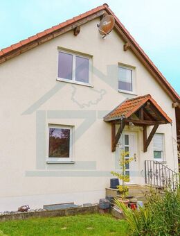 Familienglück mit Weitblick: Großzügiges Haus mit Wintergarten und sonnigem Garten - Reinstädt