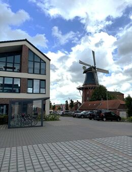 Wohnen am Norder Tief: Schöne Erdgeschosswohnung mit Blick auf die Mühle - Norden